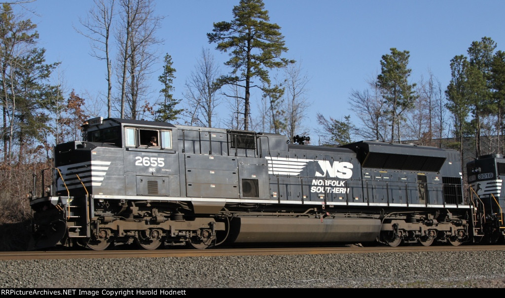 A friendly wave comes from the cab of NS 2655